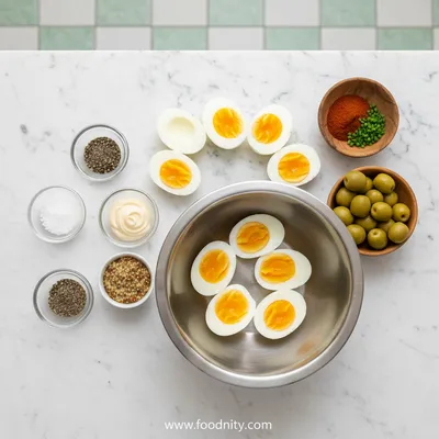 Deviled Eggs With Green Olive Garnish - cooking process